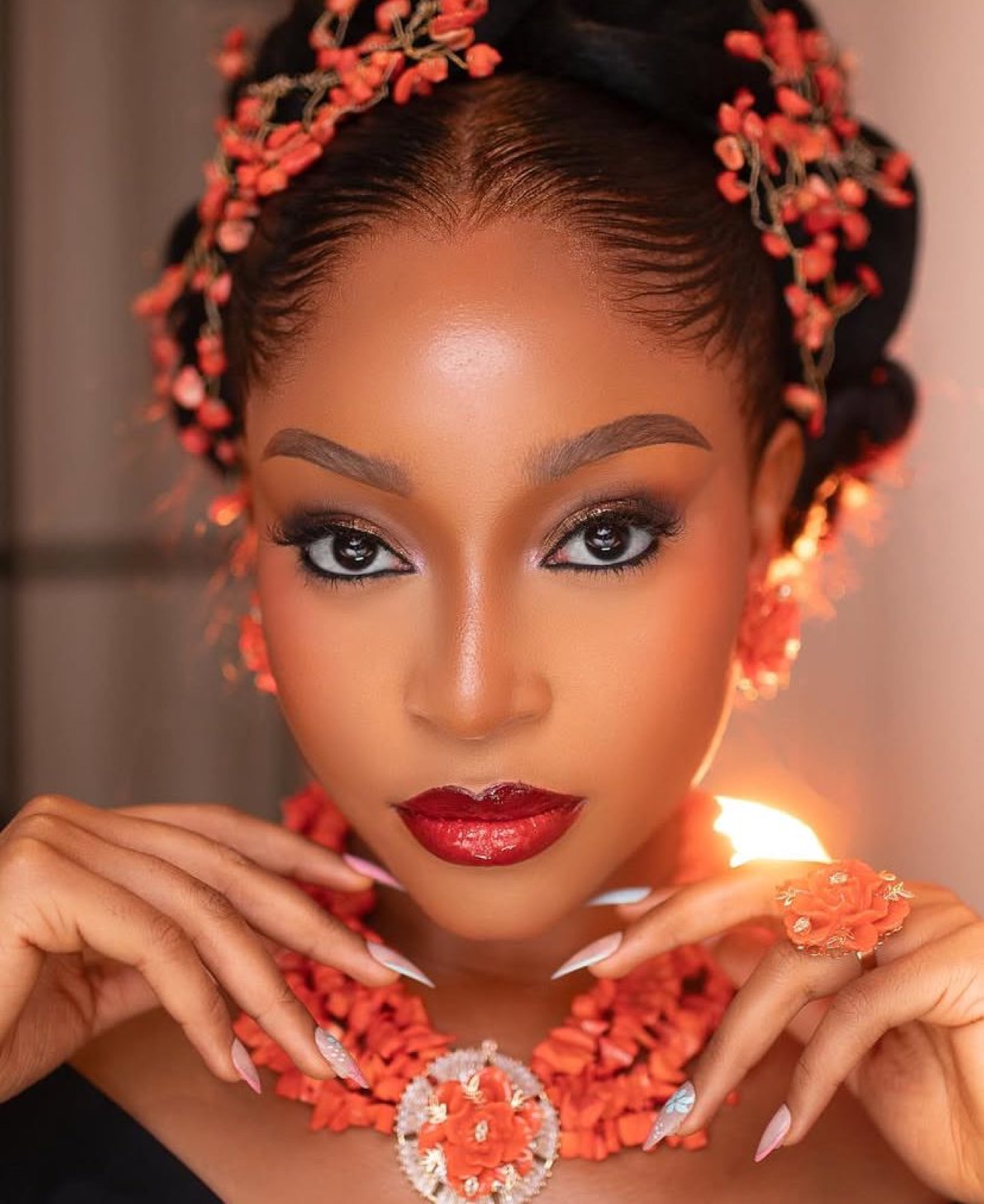 Orange bridal beauty look with coral accessories